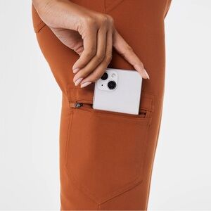 Figs Women's Scrub Pants a top in rust orange.
